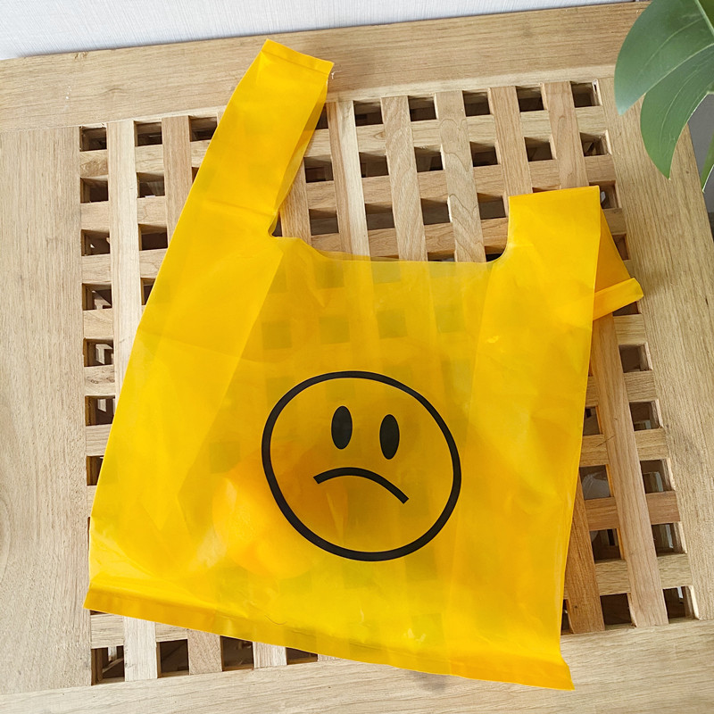 韩国ins简约黄色哭脸塑料袋透明卡通手提袋可爱礼品袋便携购物袋